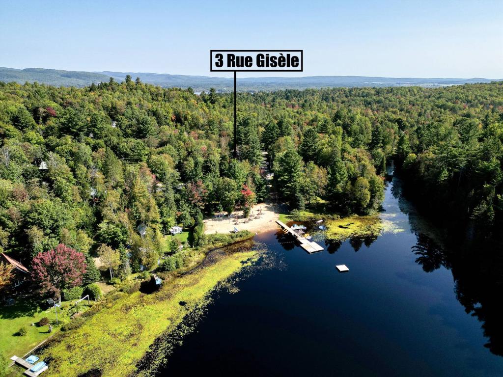 Majestueuse demeure en bois rond à quelques pas d'un lac