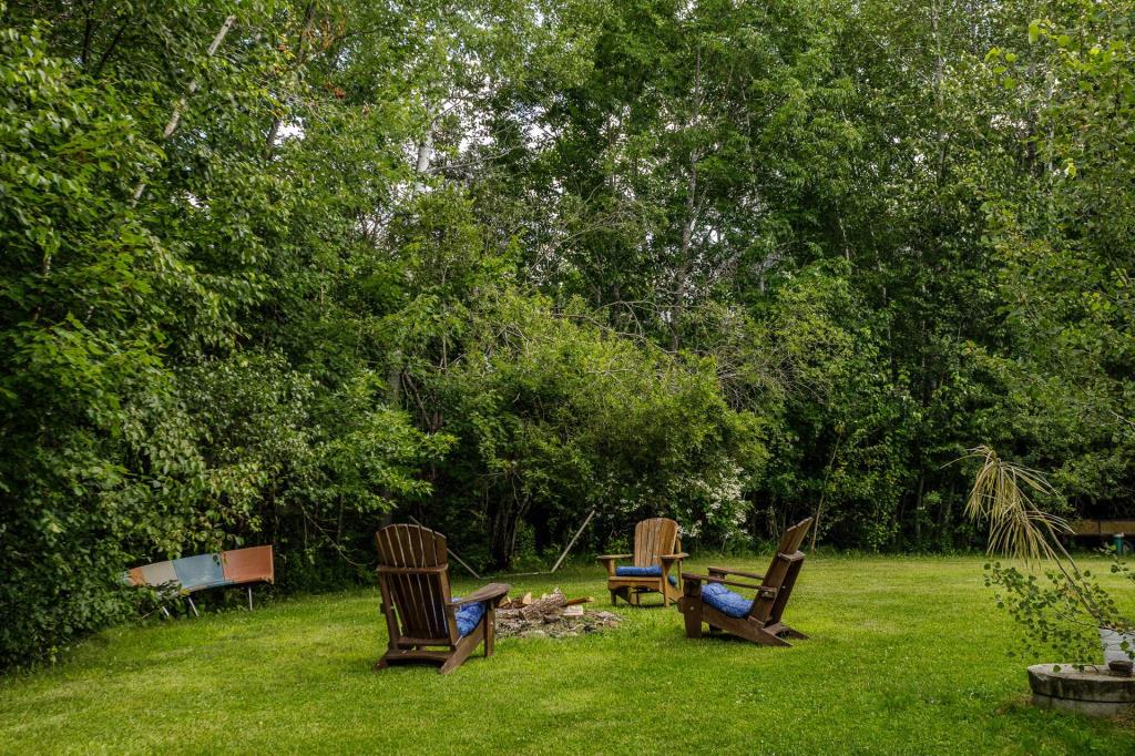 Élégant cottage sur un site boisé intime à 2 pas d'un lac