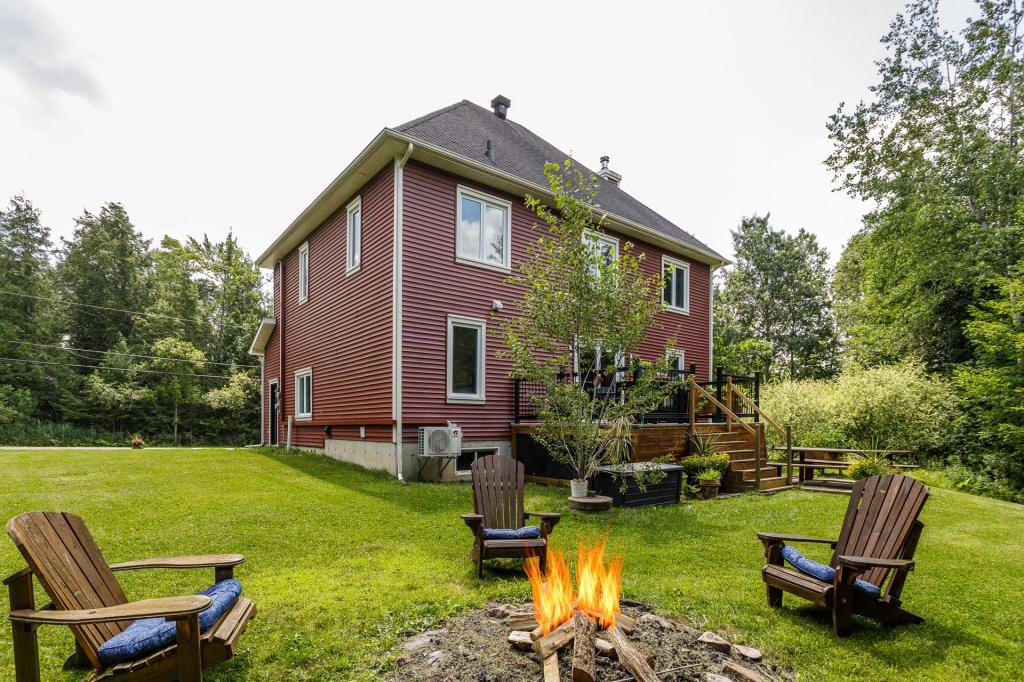 Élégant cottage sur un site boisé intime à 2 pas d'un lac