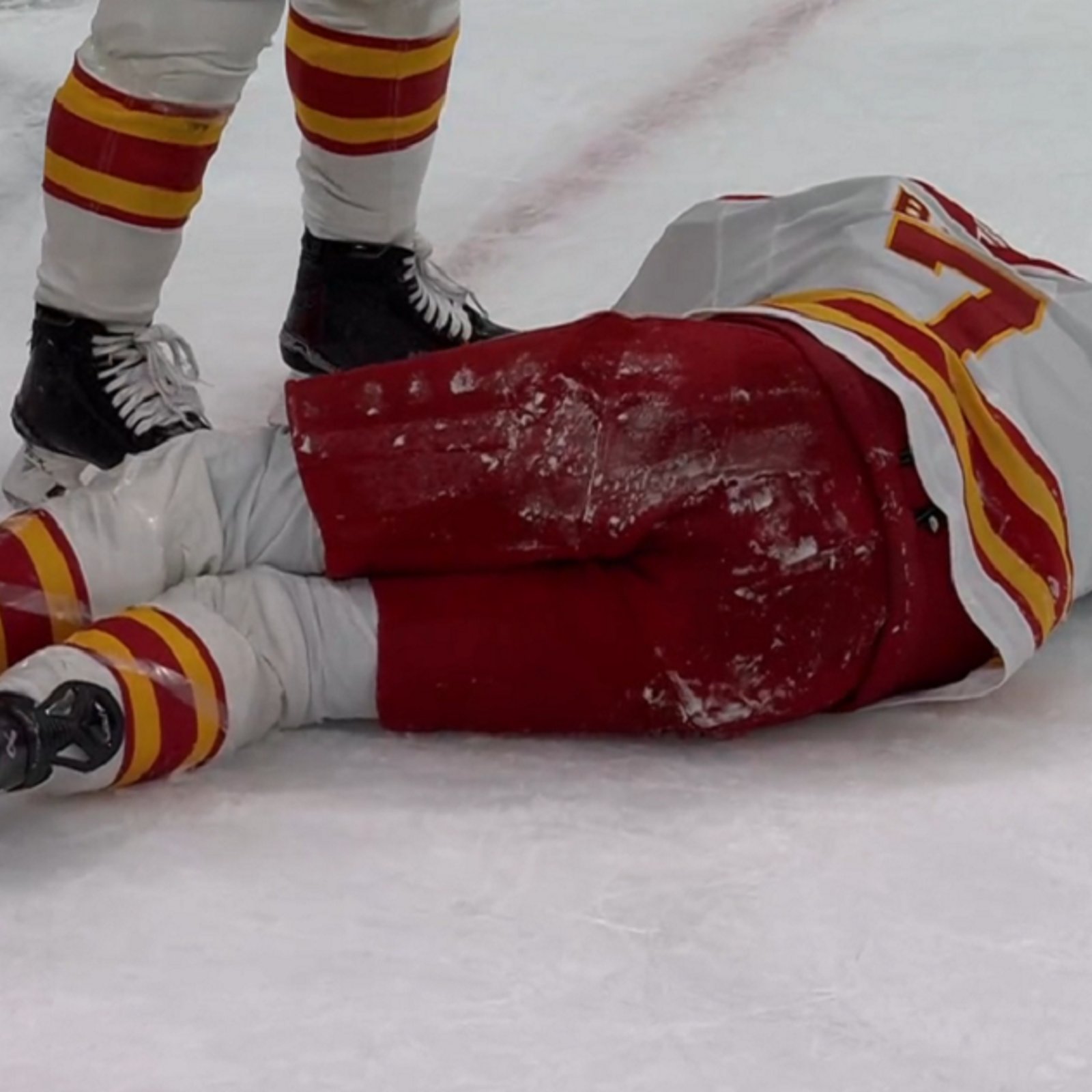 Kevin Bahl goes down after taking a puck to the back of the head.