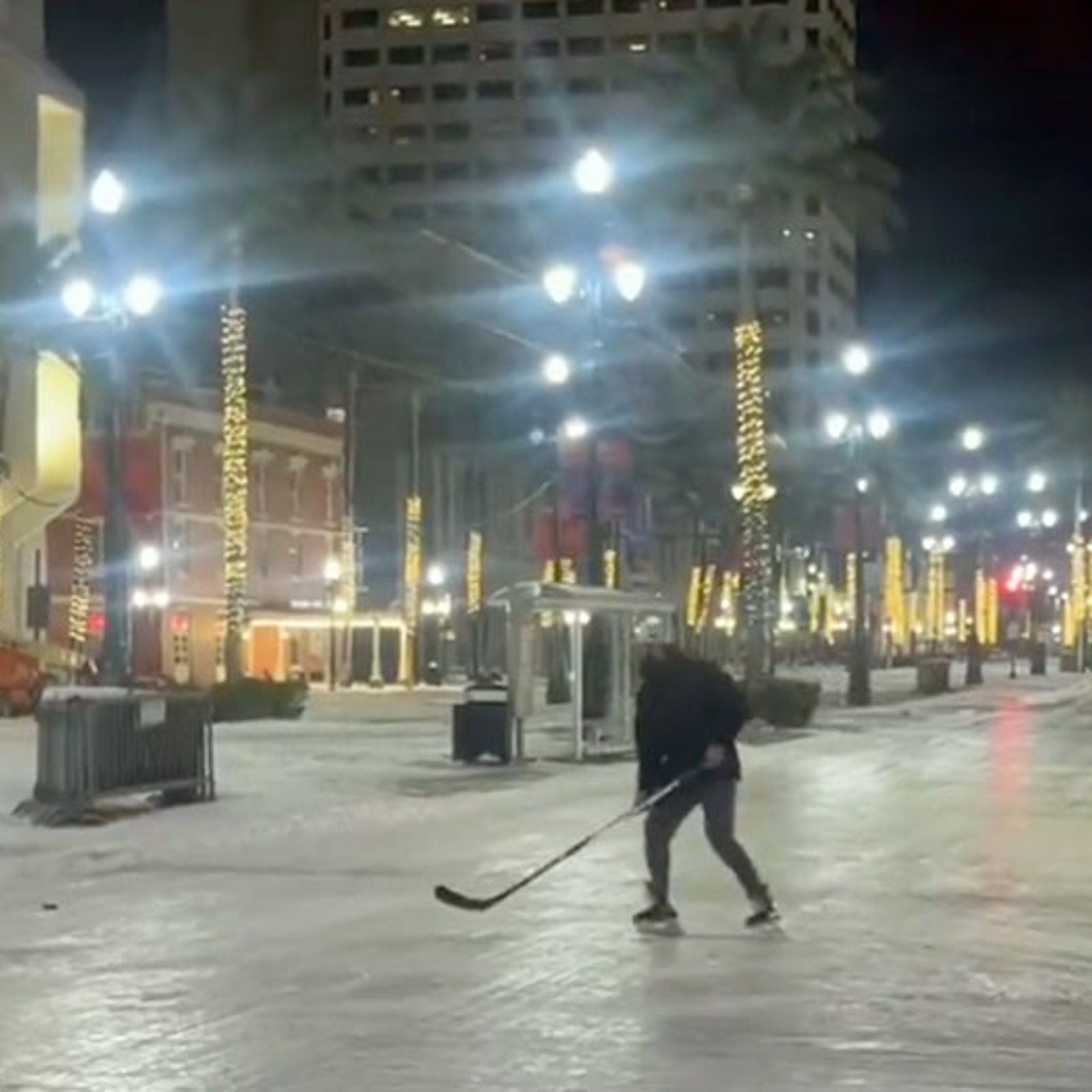 It's so cold in New Orleans that people are playing hockey on Bourbon St.