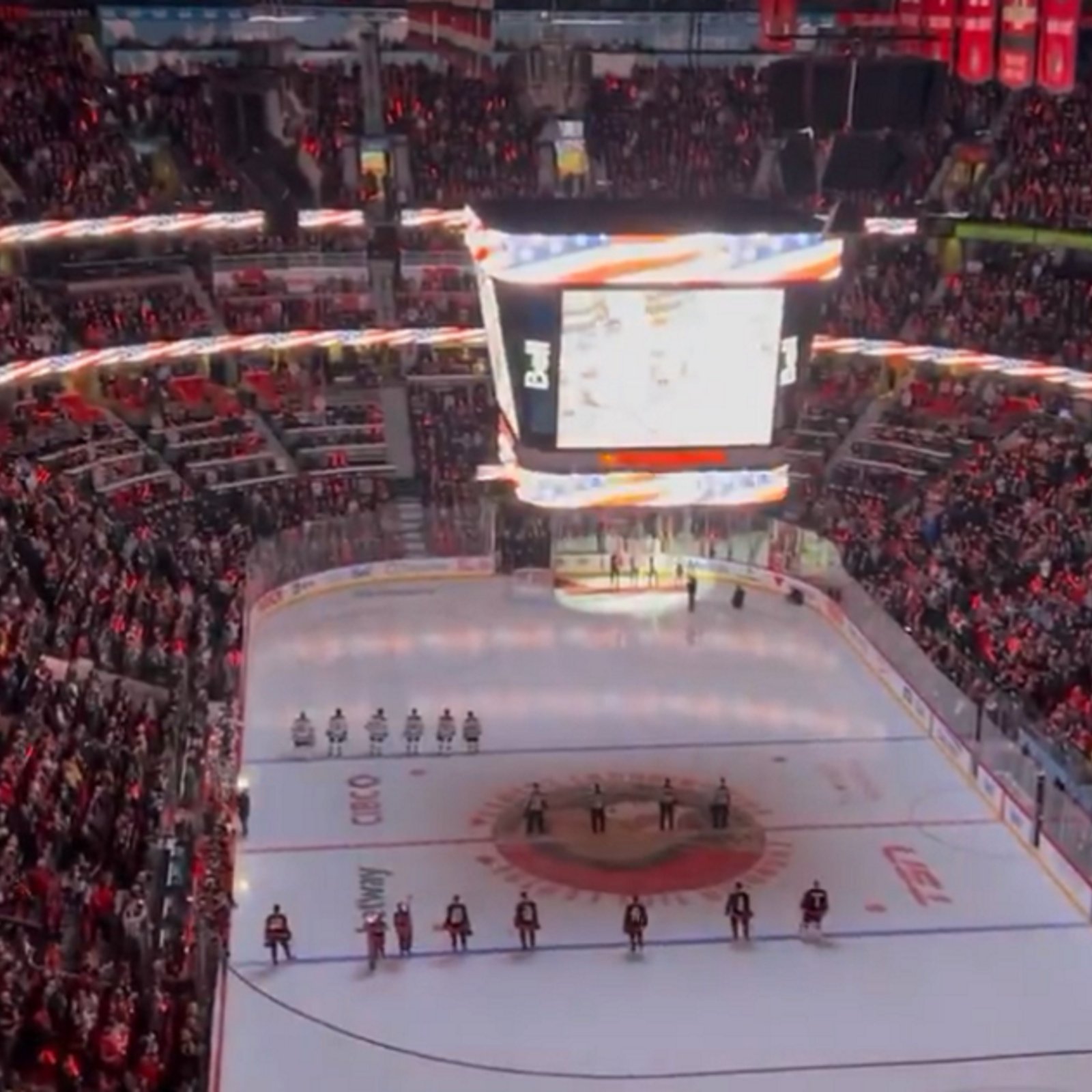 Canadian fans boo American national anthem during NHL game.