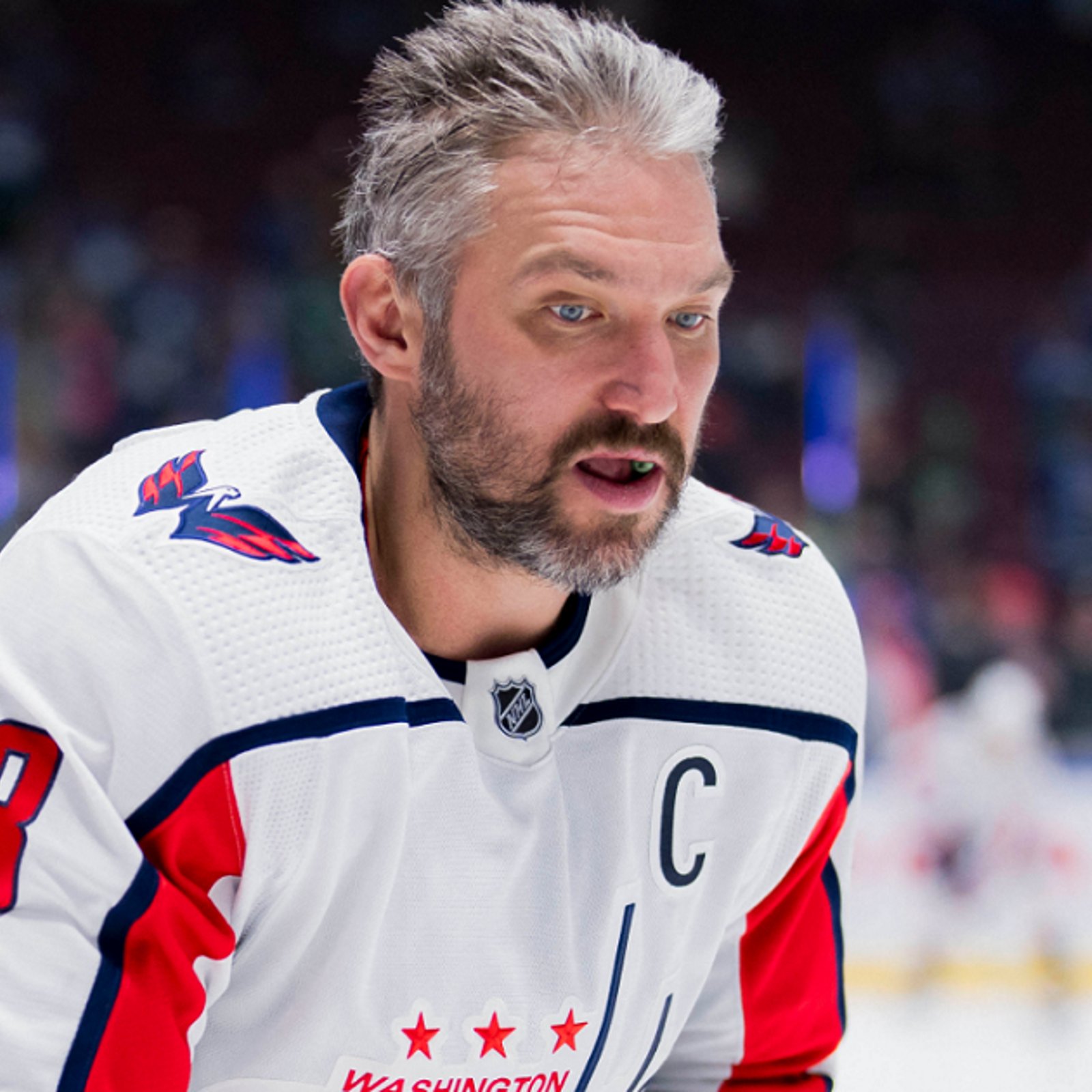 Alex Ovechkin leaves the ice after wincing in pain on Monday.