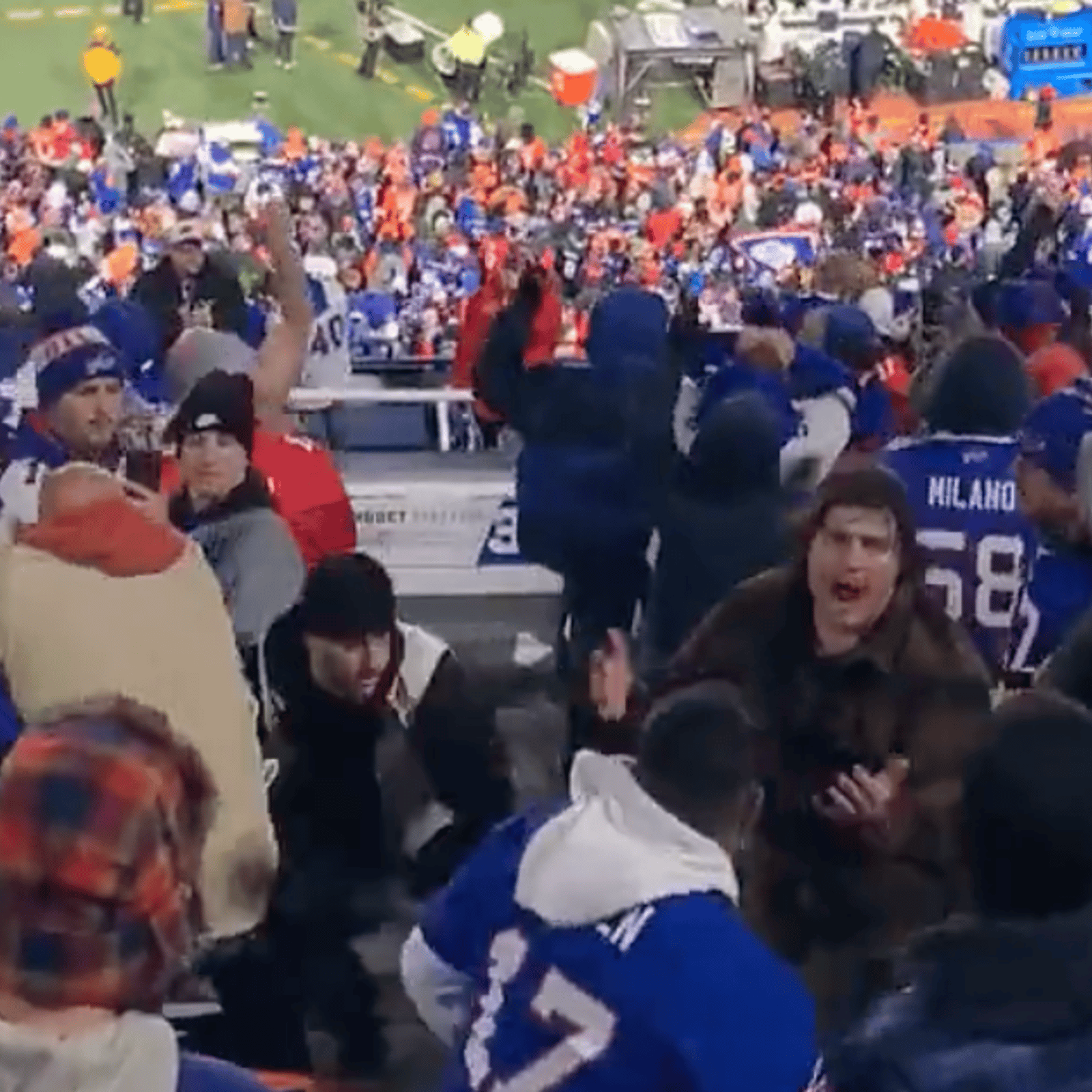 Bills fans brawl in the stands with one another! 