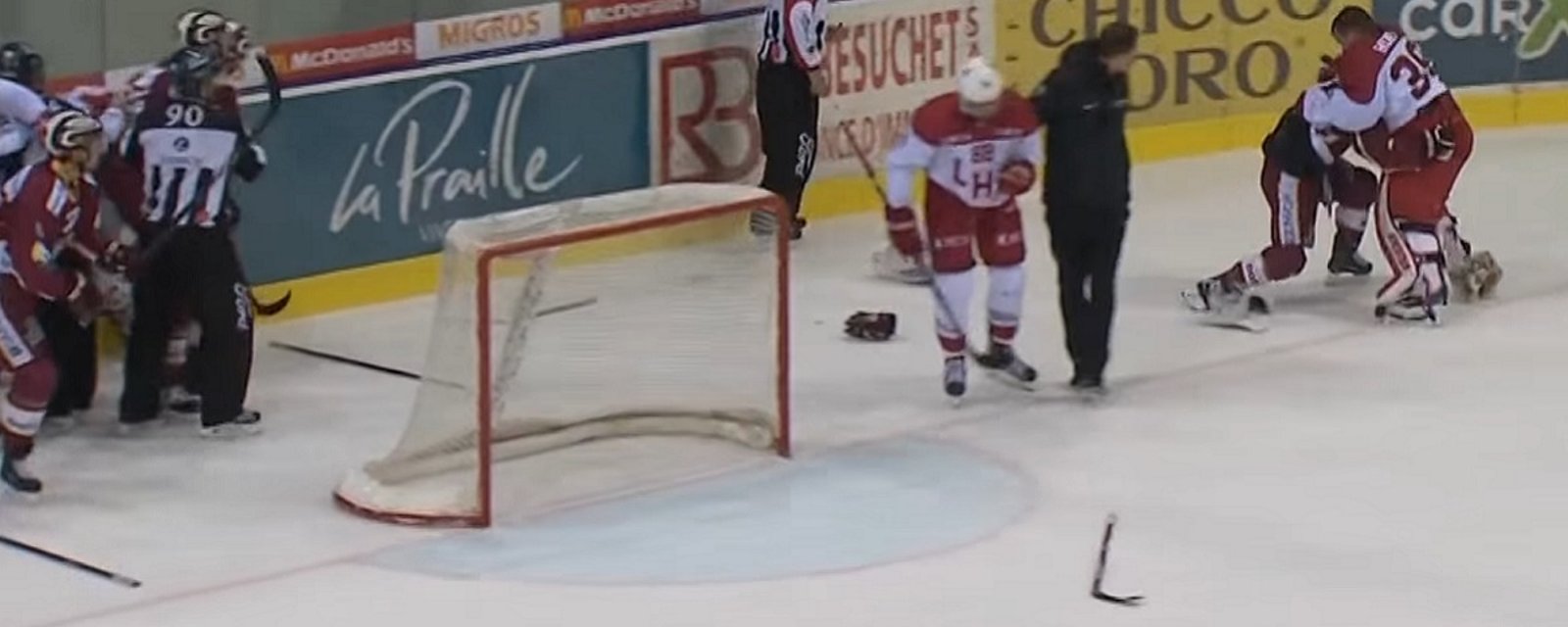 Former NHL goalie and former NHL forward drop the gloves.