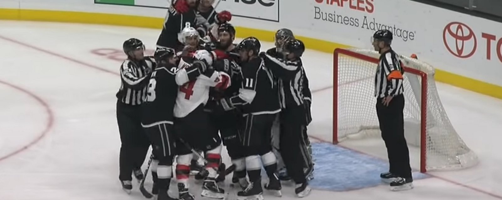 Quick loses his cool and breaks Wood's stick with one hand.