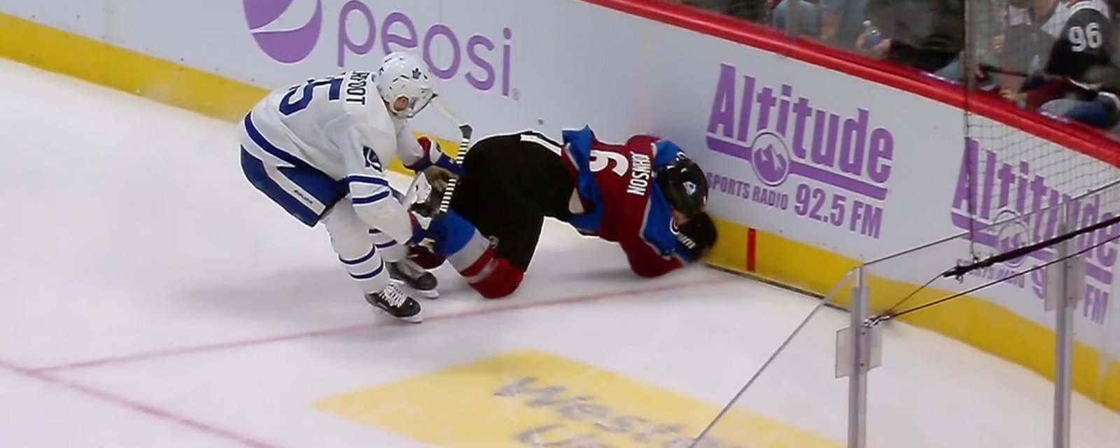 Alex Kerfoot sends Erik Johnson head first into the boards.