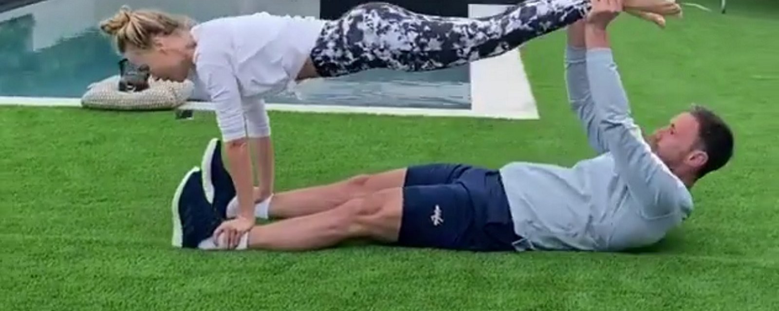 Ilya Kovalchuk uses his wife as improvised workout equipment during COVID-19 lockdown.
