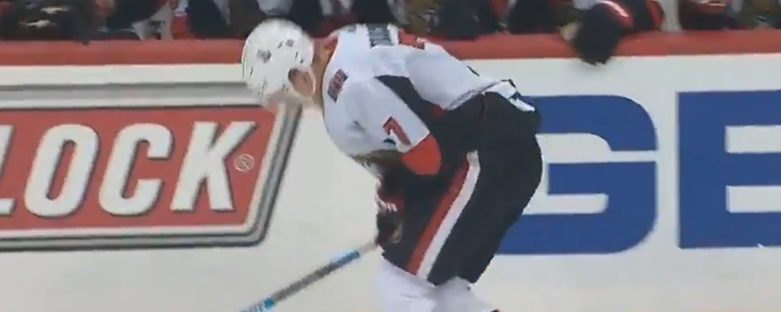 Brady Tkachuk hurts himself while trying to crosscheck Jake Guentzel.