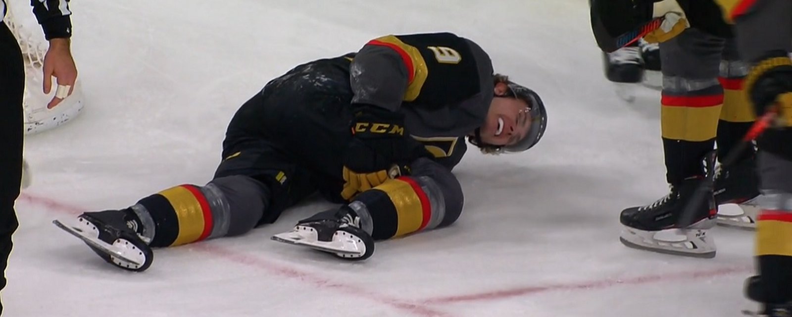 Cody Glass carried off the ice after falling awkwardly into the net.