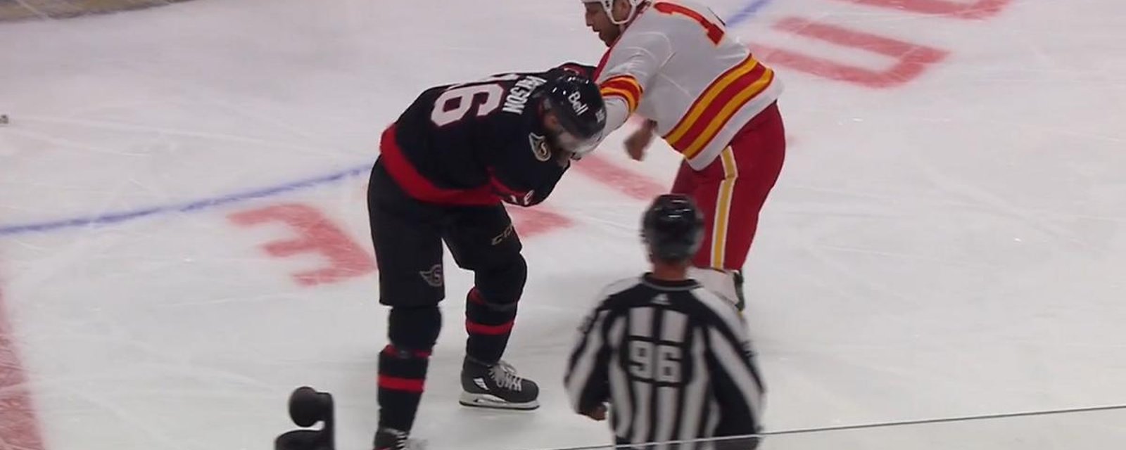 Milan Lucic manhandles Austin Watson.