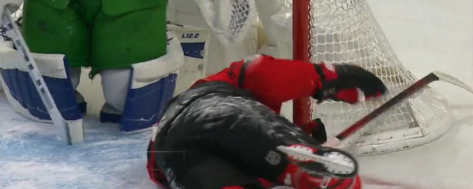 Mitch Marner sends Brady Tkachuk into the goalpost, nearly head first.