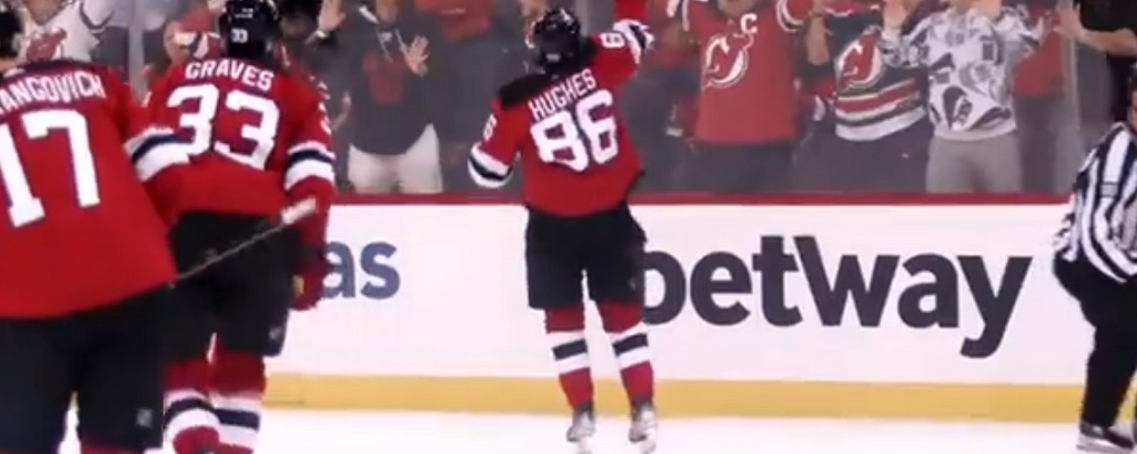 Jack Hughes throws his stick into the crowd after incredible OT winner.