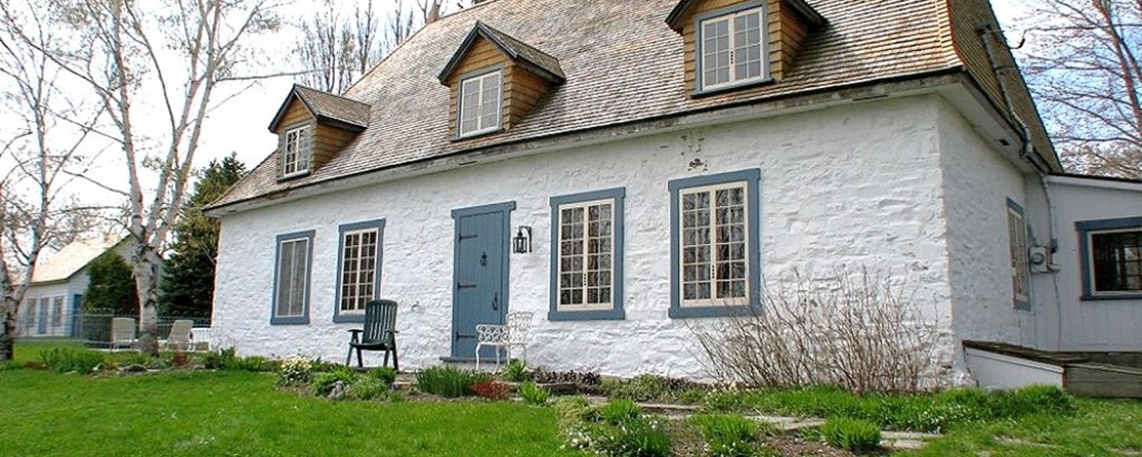 Ancestrale sublime de l'Île d'Orléans avec murs de pierre d'époque et un cachet exceptionnel