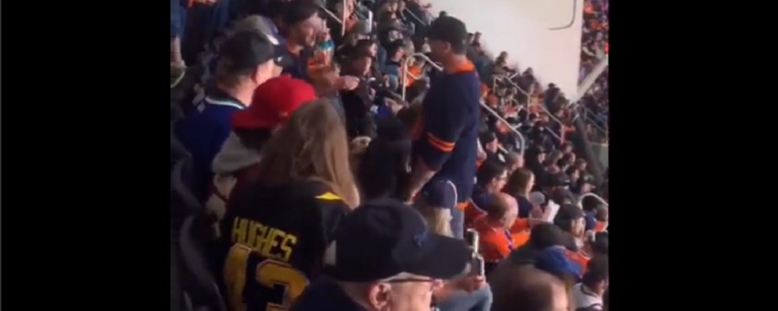 Oilers fan humiliates himself when fight breaks out in the crowd.