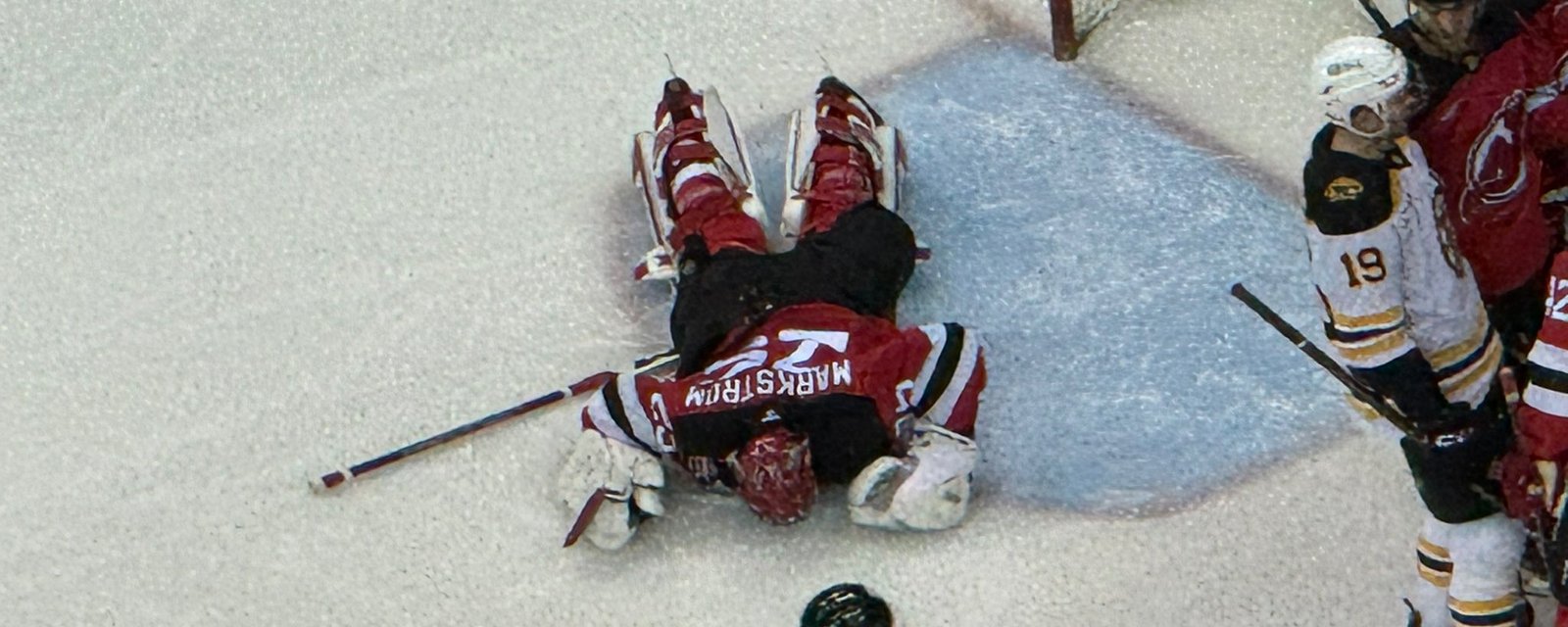 Goalie Jacob Markstrom gets badly run over and is down in serious pain!