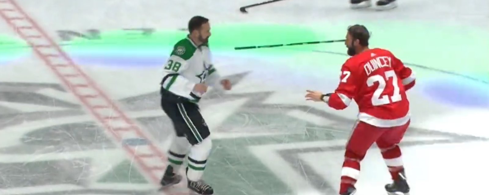 Vern Fiddler and Kyle Quincey drop the gloves during an alumni game.