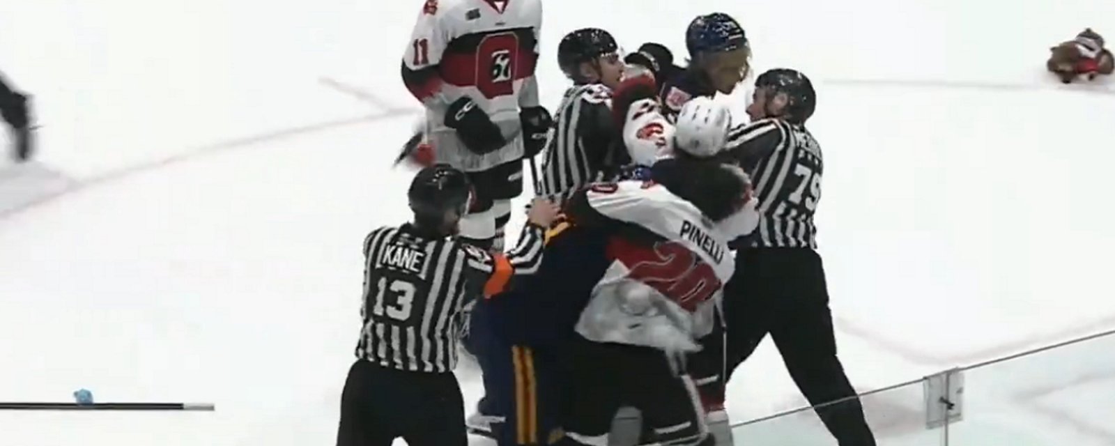 Brawl erupts on the ice during Teddy Bear Toss.