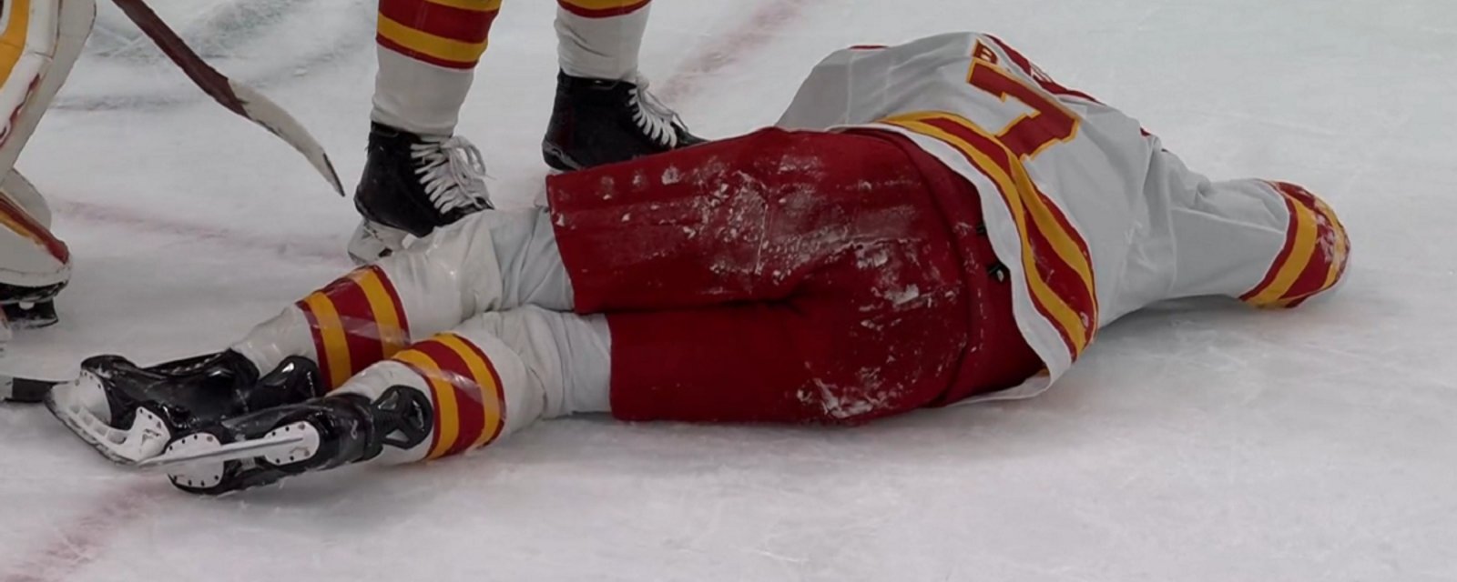 Kevin Bahl goes down after taking a puck to the back of the head.