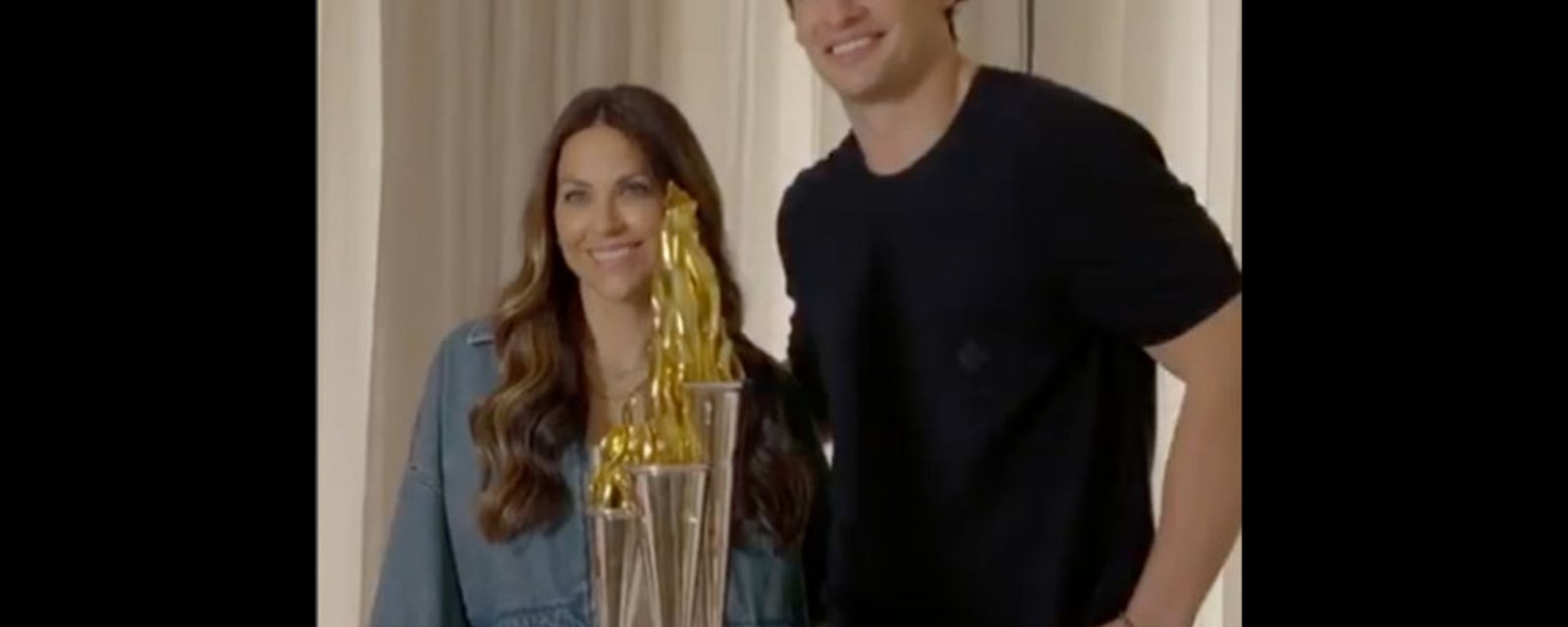 Johnny Gaudreau’s wife, Meredith, surprises Sean Monahan with the Bill Masterton Memorial Trophy