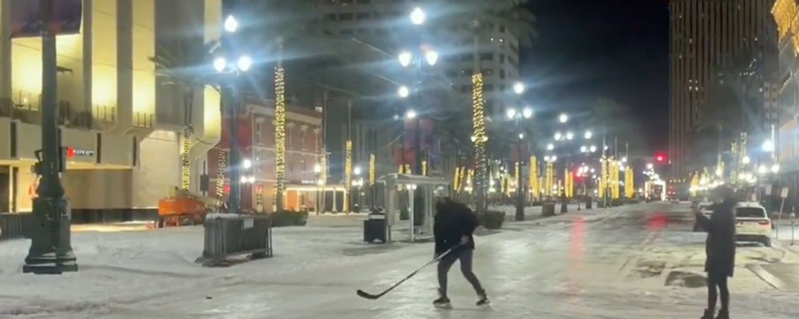 It's so cold in New Orleans that people are playing hockey on Bourbon St.