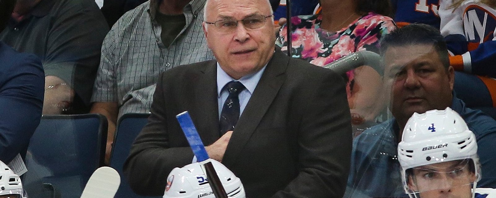 Barry Trotz loses his cool, throws a stick out onto the ice.