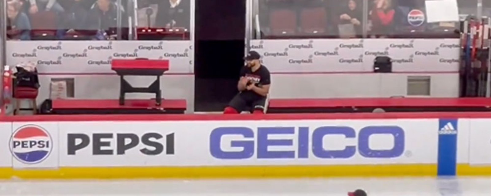 Nick Foligno sits on bench for the 1st intermission, watches his son skate in relay race 