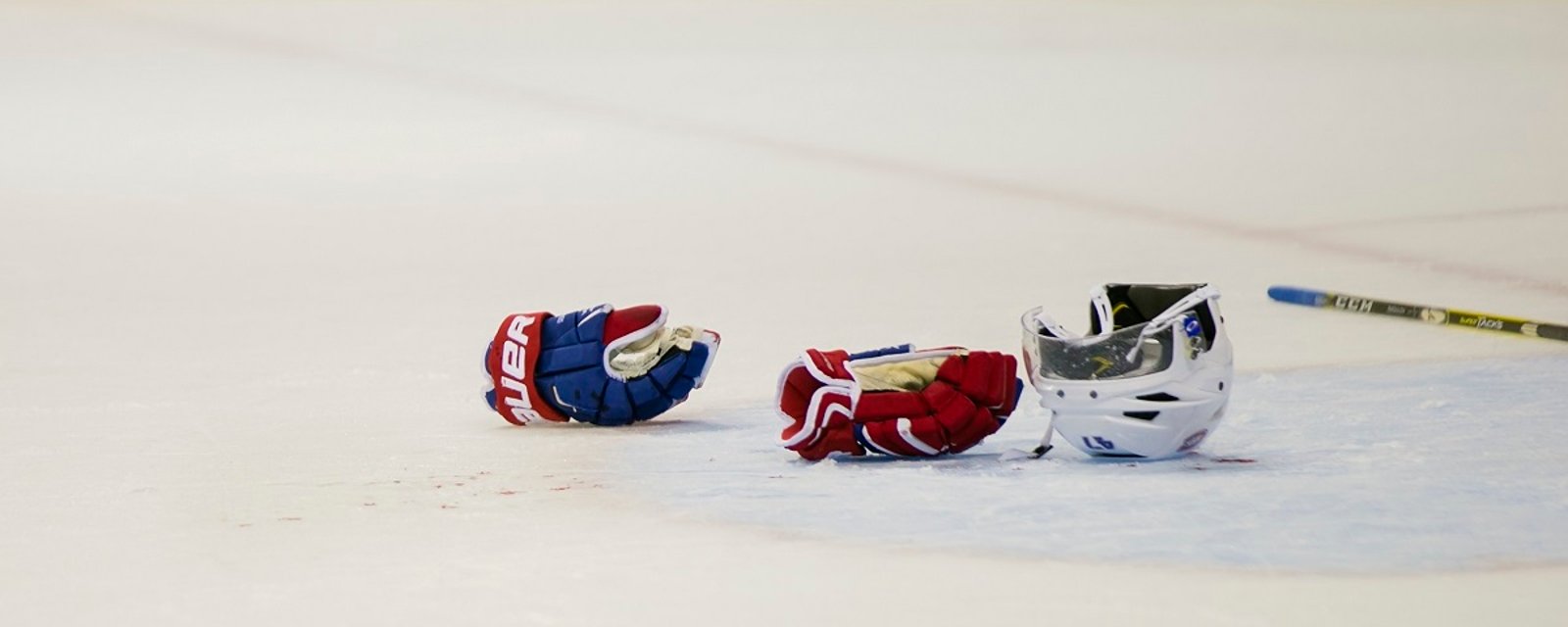 “Full blown, stick-swinging brawl” erupts during hockey game.