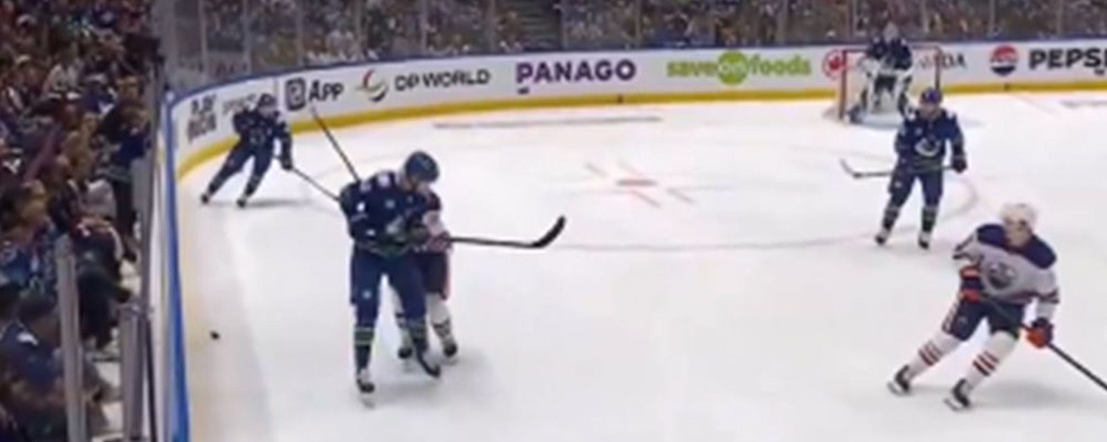Canucks fans litter the ice with garbage after an absolutely brutal call from the refs