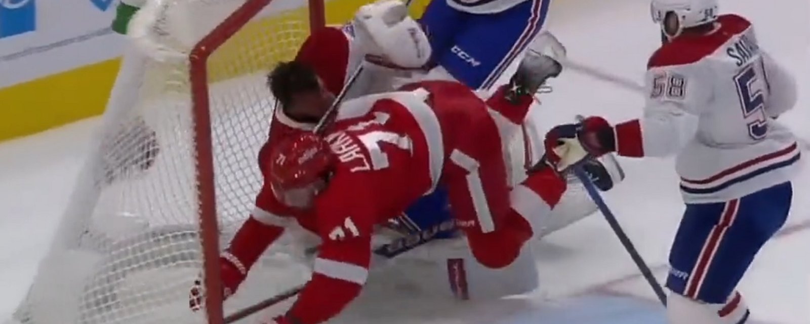 Dylan Larkin crashes into Jake Allen, knocking him out of the game.
