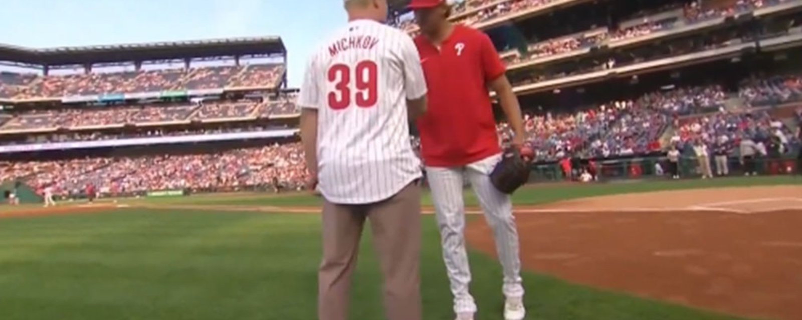 Matvei Michkov throws out the first pitch for the Phillies