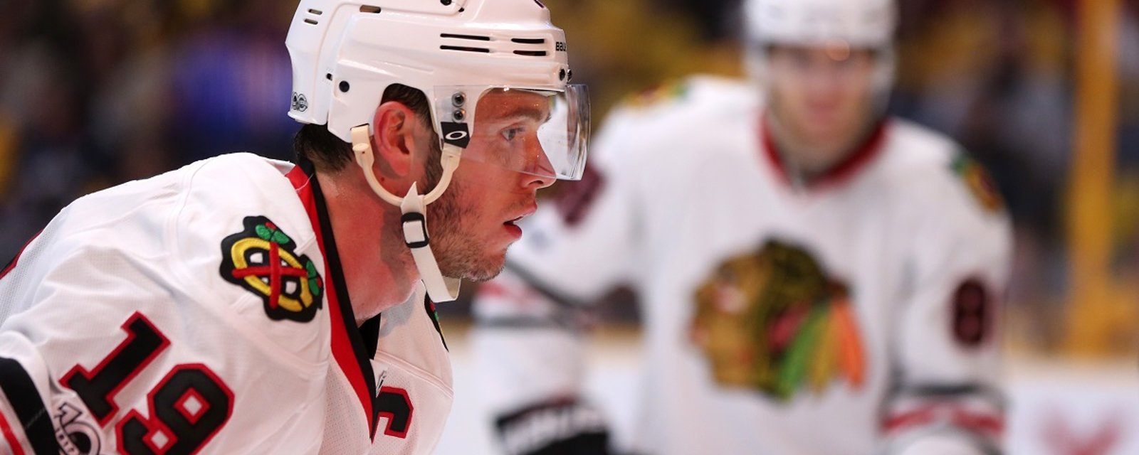 Maxim Lapierre buries Blackhawks captain Jonathan Toews.