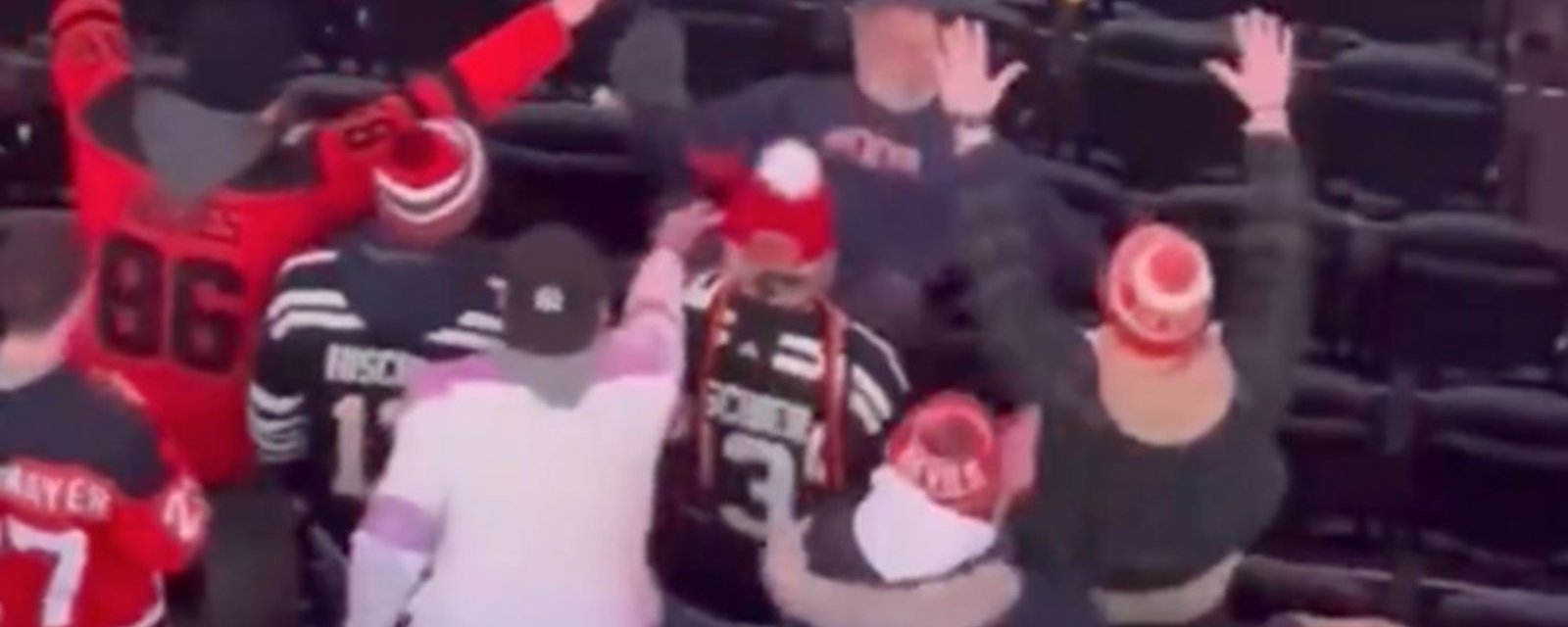 Drunken Rangers fan makes a fool of himself trying to fight Devils fans