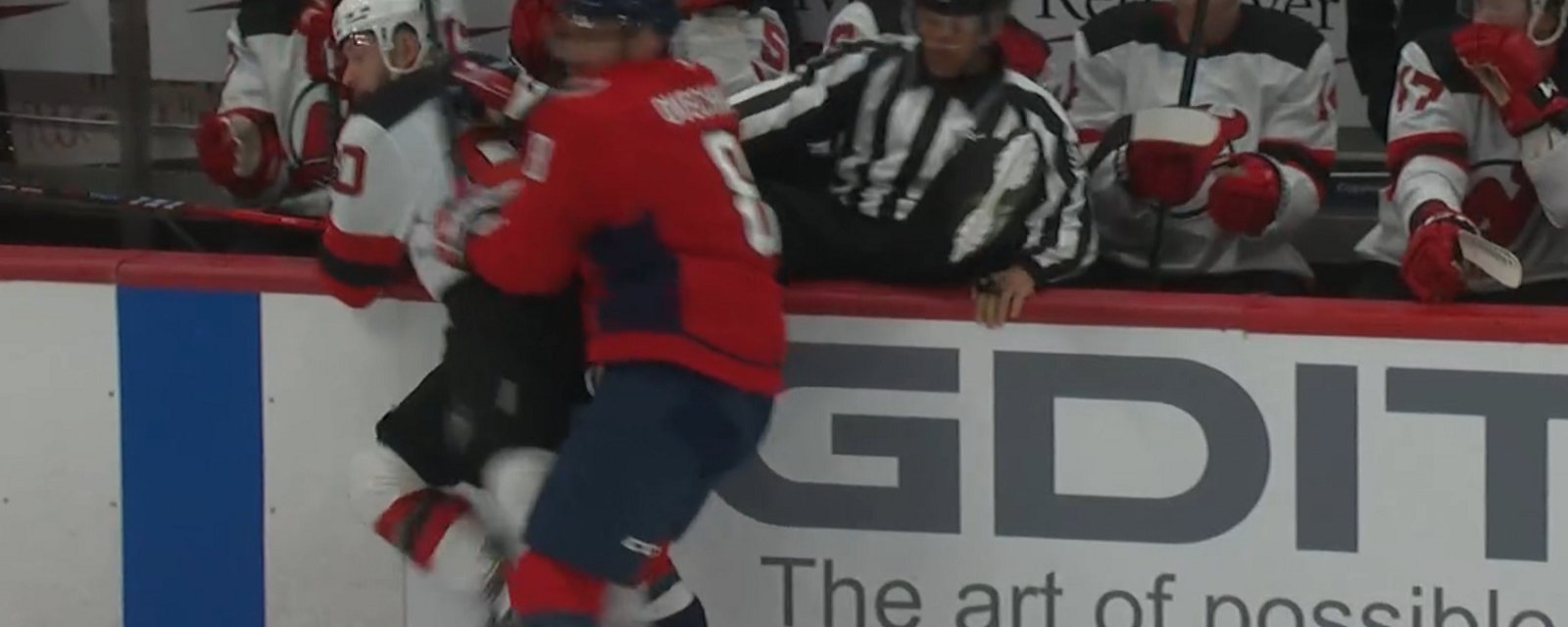 Alex Ovechkin dumps linesman into the bench on Saturday.