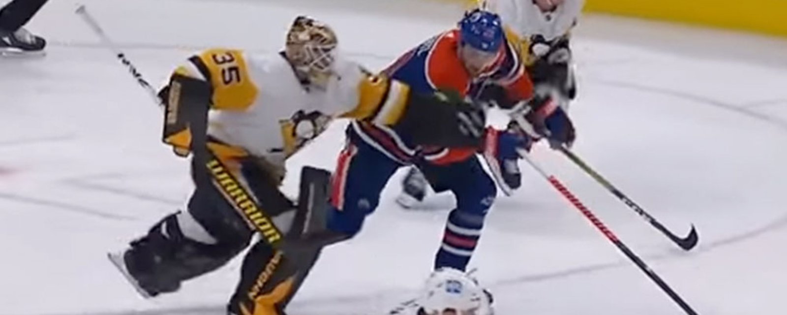 Tristan Jarry takes Leon Draisaitl out with crazy leg sweep in the neutral zone