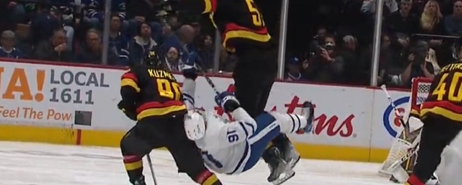 Tyler Myers flattens John Tavares.