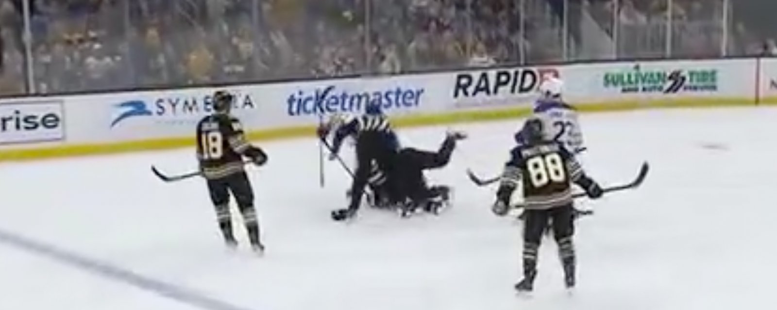Linesman tackles and wrestles Brad Marchand down on the ice!