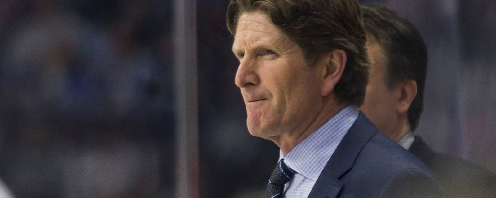 Mike Babcock spotted at NHL game wearing a teams gear.