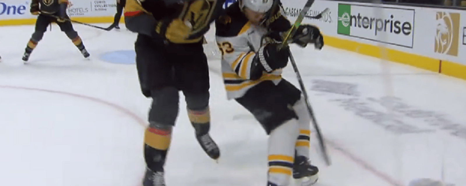 Brad Marchand gets clotheslined at the end of the period.