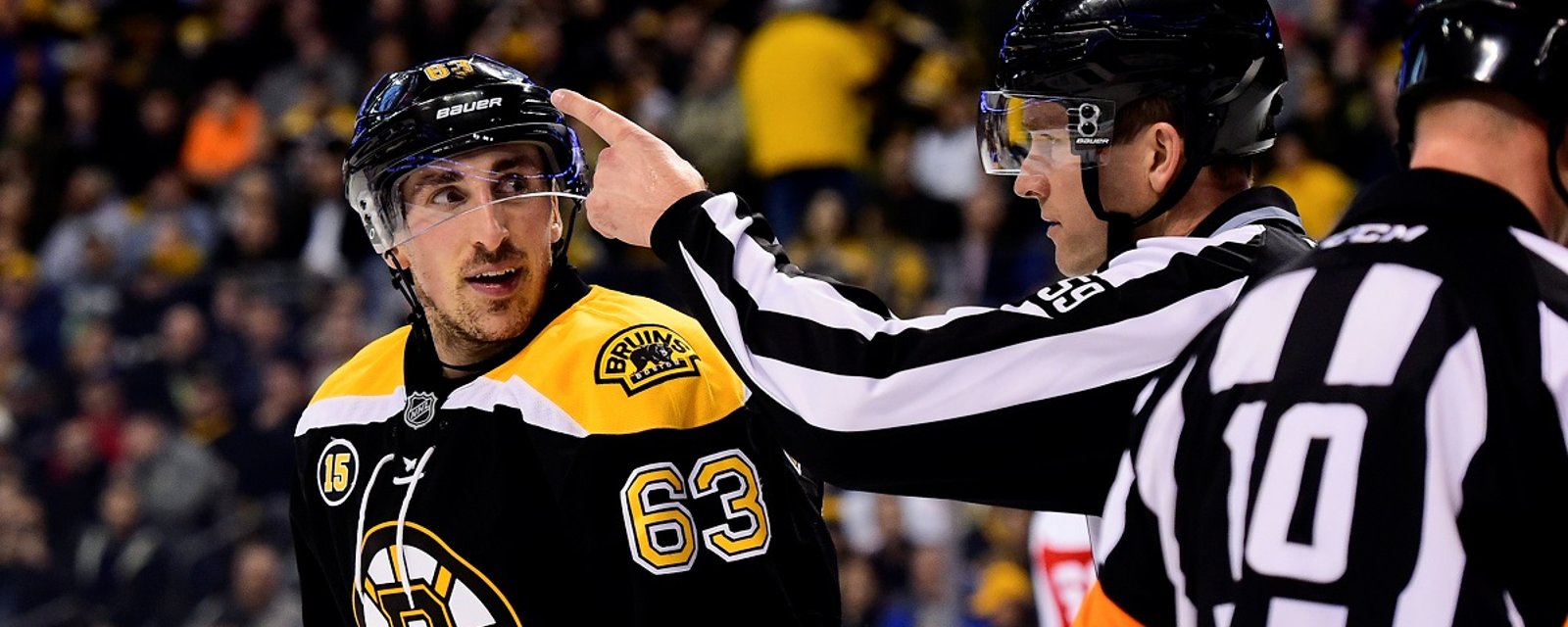 Cameras appear to catch Brad Marchand yelling expletives at Brady Tkachuk.