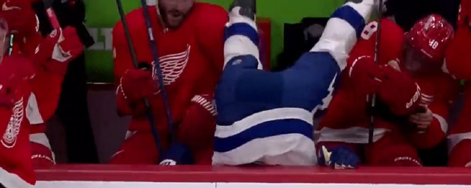 Mikey Eyssimont gets dumped head first into the bench.