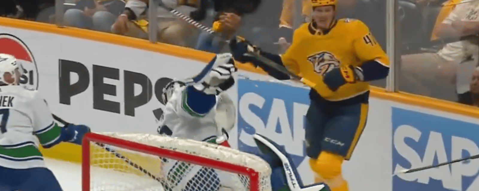 Michael McCarron bulldozes Casey DeSmith behind the net 