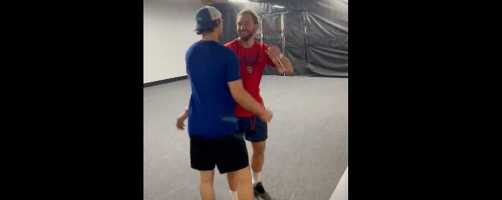 Blueger and Balinskis fight during the game, then hug it out afterwards