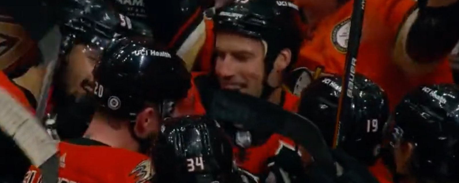 Ryan Getzlaf is mobbed after making NHL history.