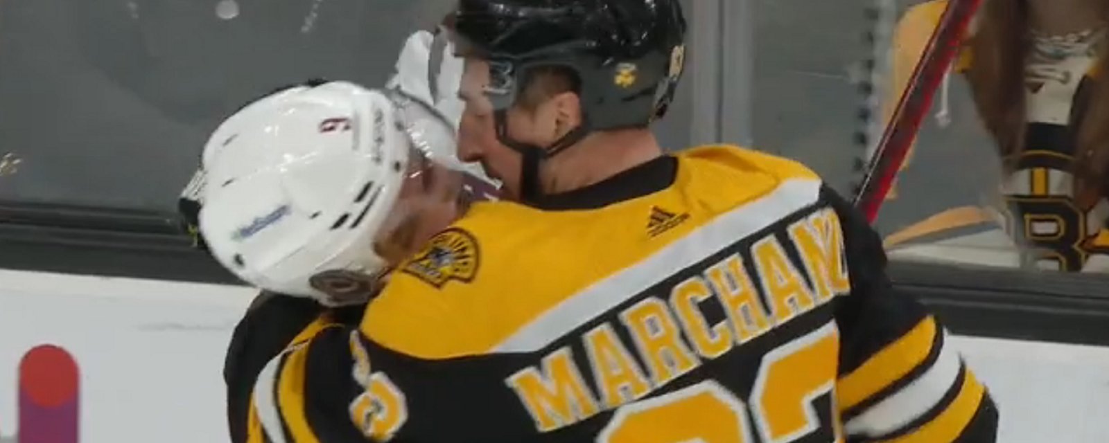 Brad Marchand gets up close and personal with Clayton Keller.