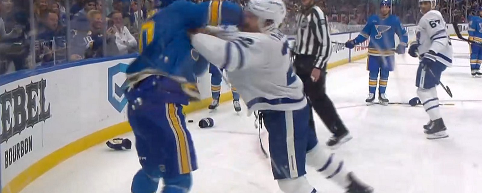 Jake McCabe and Brayden Schenn drop the gloves just minutes in.