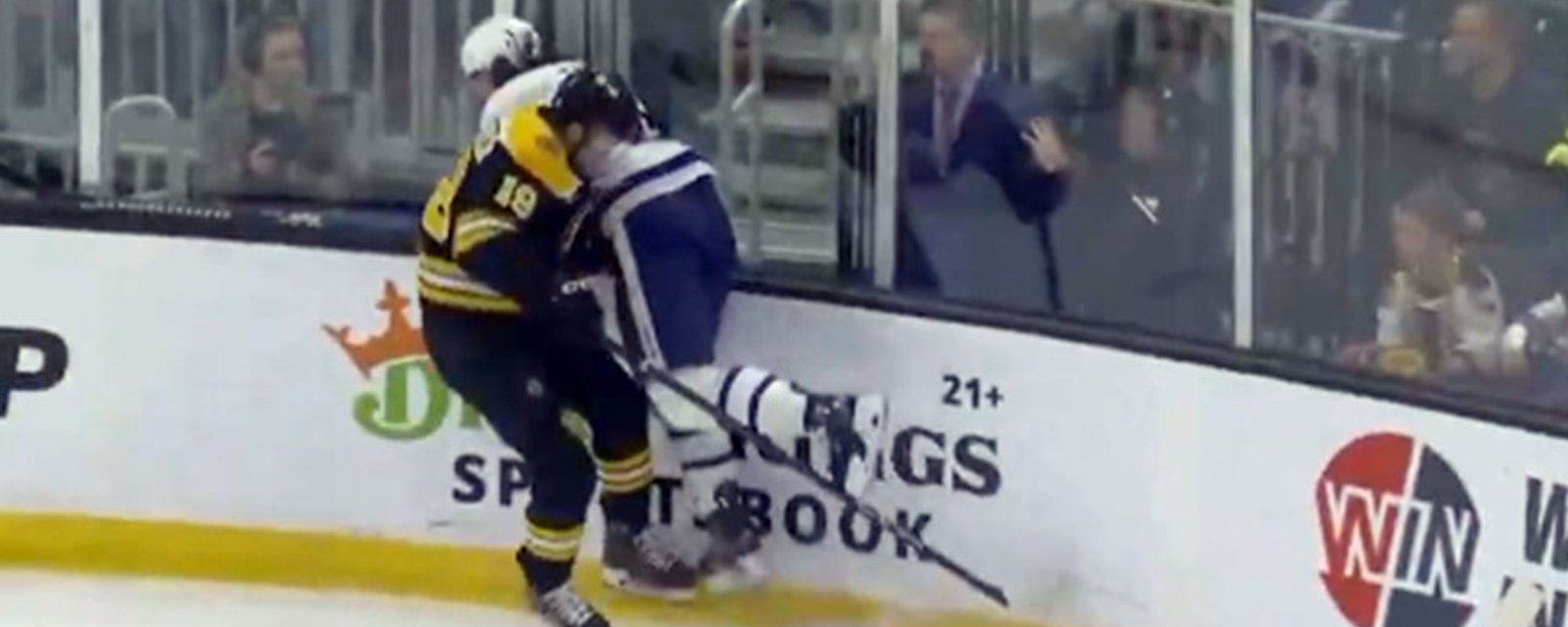 Chris Tanev takes a huge hit from Beecher, leaves the game with injury
