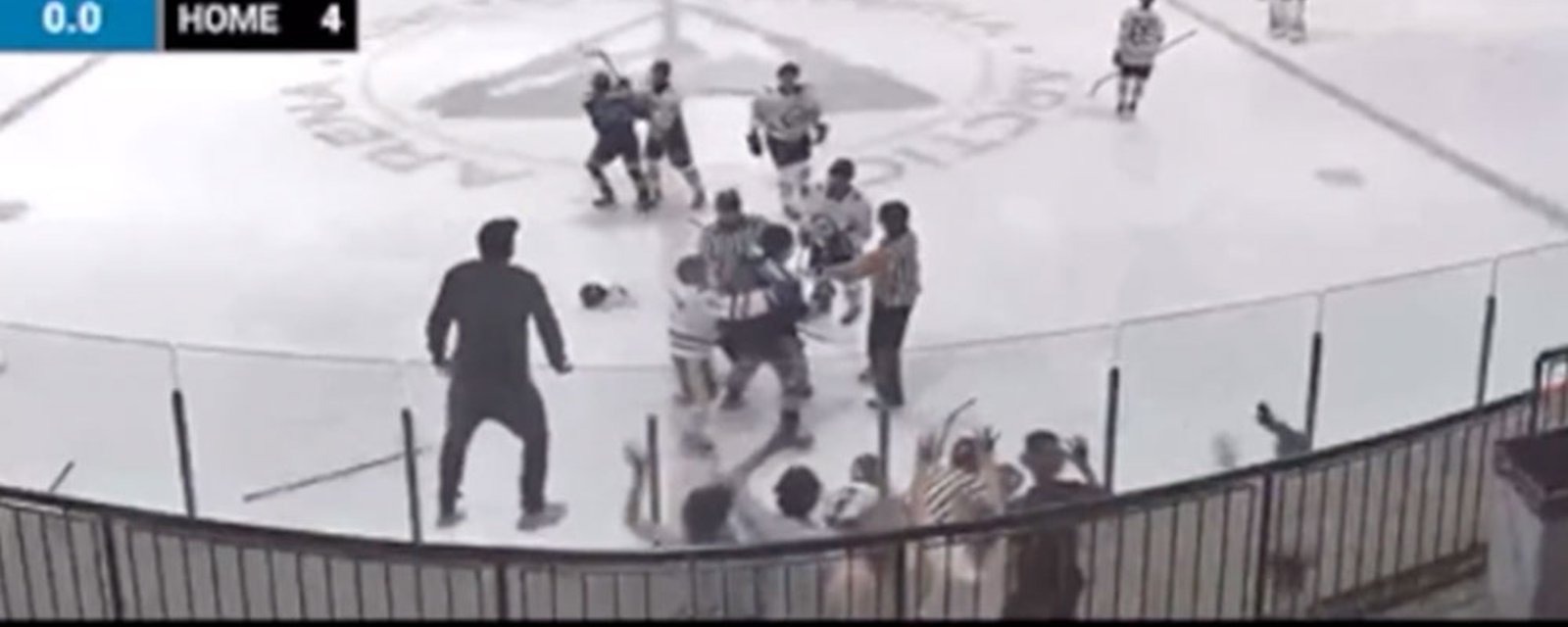 Hockey Dad tries to get on the ice to help his son, gets absolutely clocked by opposing fan