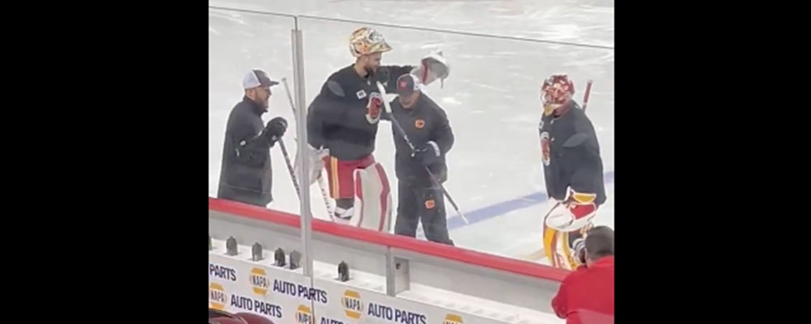 Guy Gaudreau gets a special surprise from Flames goalie Dan Vladar at practice today