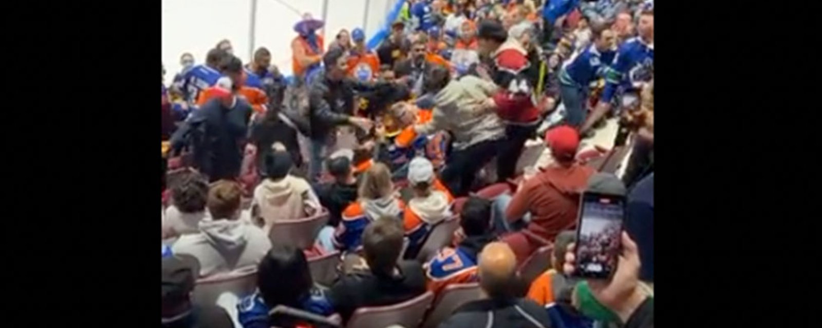 Oilers fan tries to fight Canucks fans in the stands last night